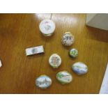 A group of eight enamelled pill boxes to include Halcyon Days