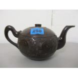 An early 20th century oriental carved coconut teapot, 4 h