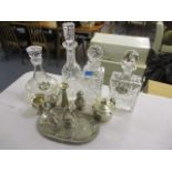 Silver plate to include a butter dish, condiments, a vase and four glass decanters
