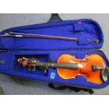 Michael Poller, Bucharest - a violin and bow in a fabric case, violin length, 20 1/2 long