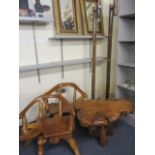 A teak natural root table and a pair of matching curved back chairs and a pair of bamboo standard