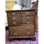 An early 19th century mahogany chest of two short and three deep drawers with facsimile fronts,