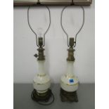 A pair of mid 20th century American pottery and brass table lamps