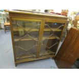 Two Edwardian mahogany bookcases, each with astragal glazed doors on bracket feet, 49 5/8h x 45 1/4w