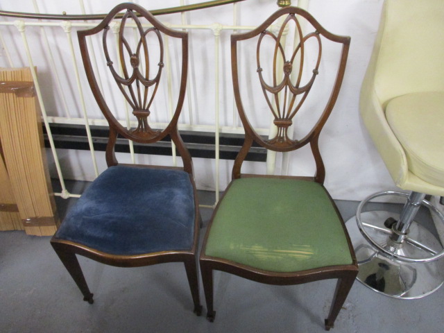 A pair of early 20th century mahogany framed, shield back bedroom chairs