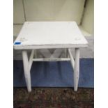 A white painted oak stool in a shabby chic fashion