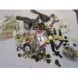 A mixed lot of coins and banknotes, costume jewellery, enamel badges, wristwatches and other items