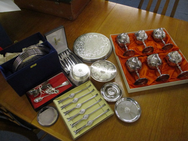 A mixed lot of silver plate to include coasters, spoons, forks, dishes, a stand, goblets and other