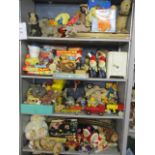 A large collection of vintage toys to include mainly soft toys, board games, dolls clothing, dolls