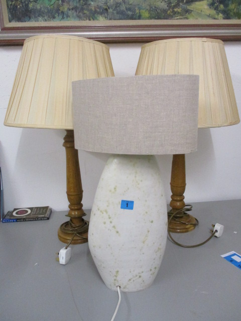 Two modern oak table lamps and shades, 27 h and a studio pottery, cream glazed table lamp, 22 h