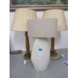 Two modern oak table lamps and shades, 27 h and a studio pottery, cream glazed table lamp, 22 h