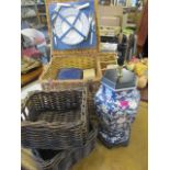 A modern Oriental style table lamp, together with two baskets and a picnic basket