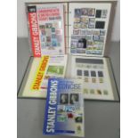 A collection of stamps together with stamp catalogues