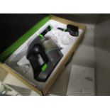 An upright GTech vacuum cleaner with box