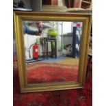 A gilt framed wall mirror with a bevelled plate, 27 x 24