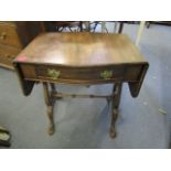 A 1920s mahogany sofa table having tyre ends, standing on claw and ball feet, 23 1/4 h x 22 3/4w