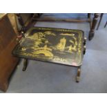 A reproduction oriental, black lacquered, chinoiserie occasional table, 20 h x 32 w