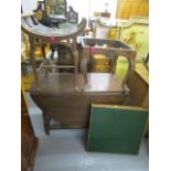 An early 20th century oak gateleg table, a 1920s oak stool with a leather seat, a carved oak