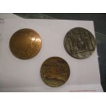 A Group of three bronze medals, a 1963 Israel State Terra Sancta medal, a centenary 1875-1975