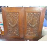 A pair of late Victorian carved treen panels