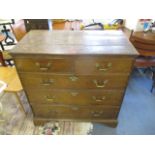 An early 18th century oak chest of two short and three graduated long drawers, raised on bracket