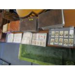 A large selection of cigarette cards to include sporting, militaria and miscellaneous cards