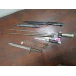 A group of three bayonets to include a stick bayonet in metal sheath and a K55 German knife in