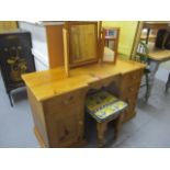 A modern pine dressing table/desk, 30 x 50 x 20, together with a pine three fold mirror and a pine