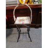 A Victorian bamboo and tiled topped occasional table