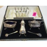 Sheffield 1936 a silver toast rack and Birmingham 1924 condiments to include salt, pepper and