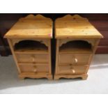 A pair of modern pine bedside chests of drawers