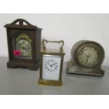 Clocks to include a silver plated, cased Edwardian mantle clock, a wooden cased mantle clock and a