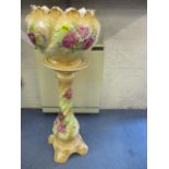 A mid 20th century pottery jardiniere with floral design