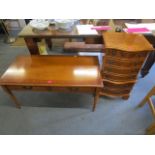 A yew wood serpentine fronted bedside chest of six drawers on bracket feet and a yew wood coffee