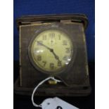 An early 20th century leather cased Buren travel clock having Arabic numerals and subsidiary seconds