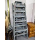 Three vintage blue painted folding wooden ladders