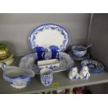 A selection of blue and white china to include meat plates, a salt and pepper pot, a pair of glass