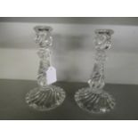 A pair of early 20th century Baccarat glass candlesticks with wrythen moulded decoration, 7" h