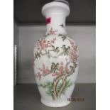 A 20th century porcelain vase decorated with birds in blossoming trees, 14" h