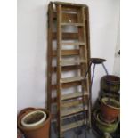 Two vintage pine folding wooden ladders