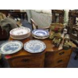 A small selection of plates, together with a brass bowl and a pair of wall lights