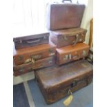 Seven vintage leather suitcases A/F