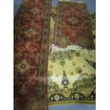 A Super Keshan hand woven runner with floral designs on a terracotta ground, 108" x 27", a similar