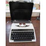 A Silver Reed cased typewriter