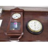 An oak cased wall clock, together with a cased circular barometer