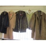 A quantity of vintage clothing to include a ladies' full length sheepskin coat and a three-quarter