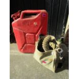 A 1950 War Department issue metal Jerry can and a 1942 Second World War gas mask