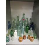 A quantity of early 20th century glass bottles to include a cobb bottle