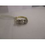 An 18ct gold three stone diamond ring in a claw setting, approx 1.6ct