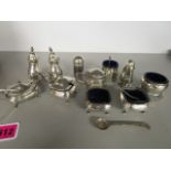 A group of silver and silver plated condiment sets